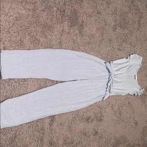 Blue and white striped v neck romper with belt.